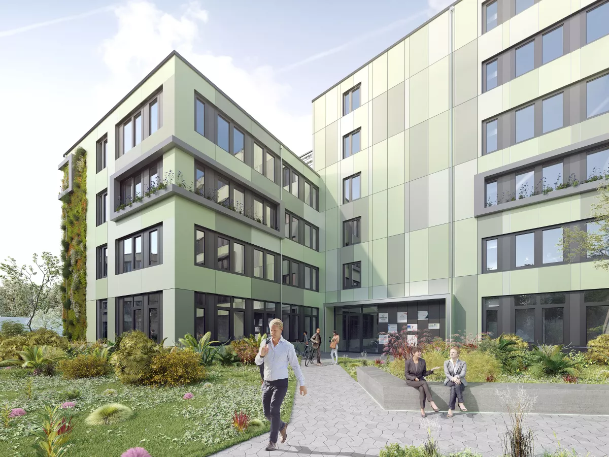 Blick auf das grün gekachelte Gebäude Cleo mit begrünter Fassade, sowie einem Weg und Personen im Vordergrund