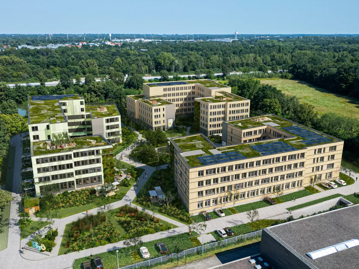 Visualisierung aus der Vogelperspektive auf einen stark begrünten Campus mit drei Gebäuderiegeln