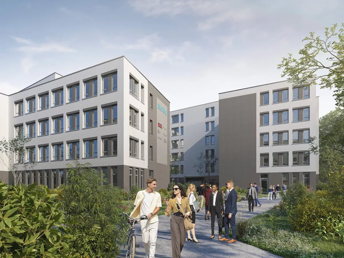 Blick auf den Eingangsbereich des grau-weißen Bürogebäudes mit Schriftzug Mona und Logos an Fassade